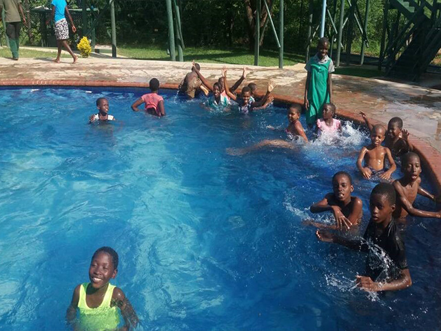 Children enjoying XMAS Party at Tamaindi Lodges <br> FUNDED BY C&C